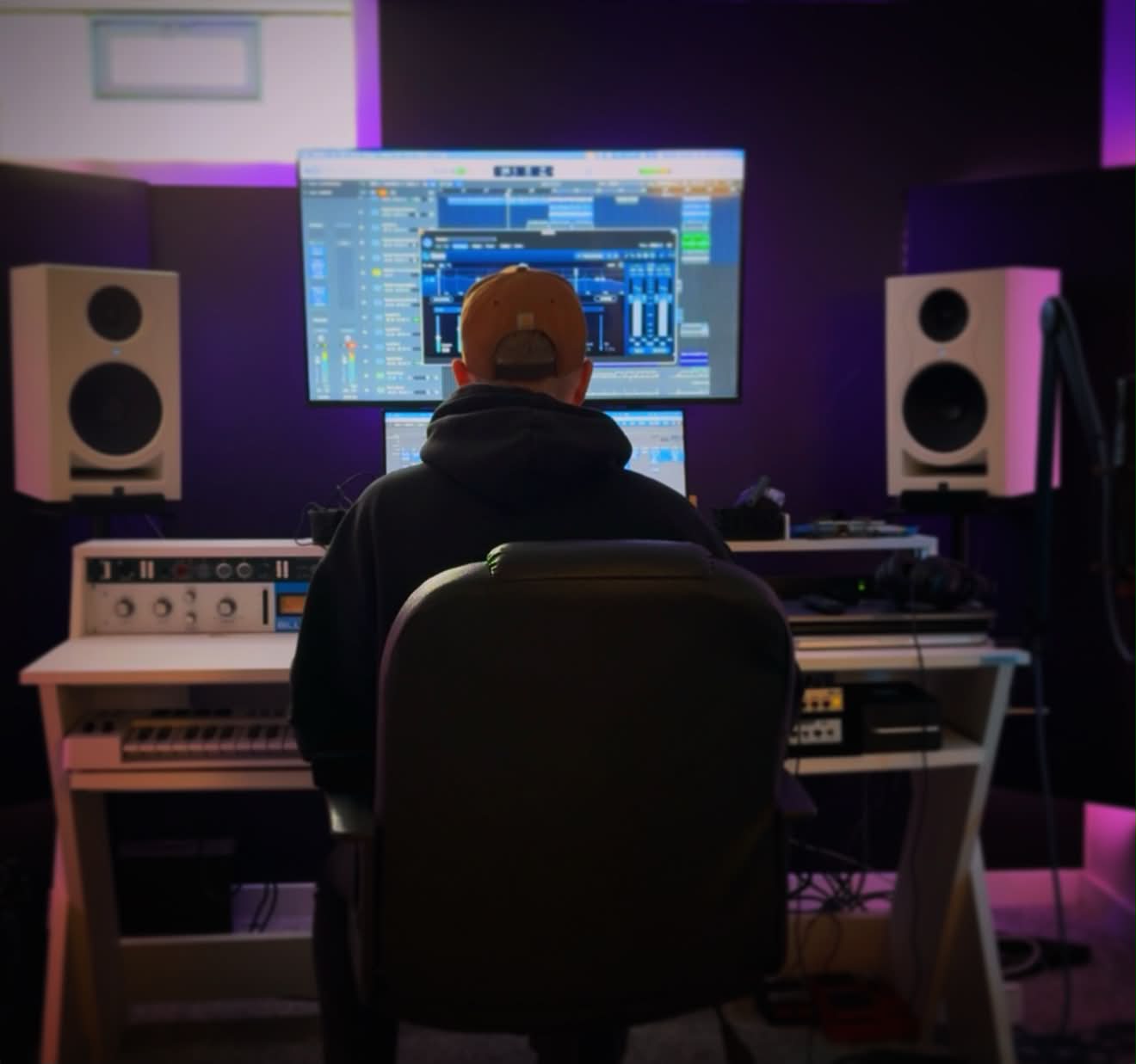 Nathan Tyler Proctor producing at the mixing console in Octave Works Recording Studio, East Grand Rapids, Michigan
